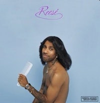 the cover of roai's album with a man holding a comb