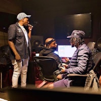 a group of people in a recording studio