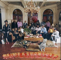 a group of people posing for a picture in a living room